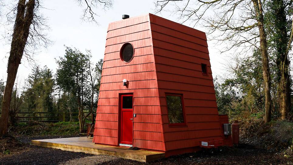 This Tiny Red Cabin Has a Lockbox for Your Phone