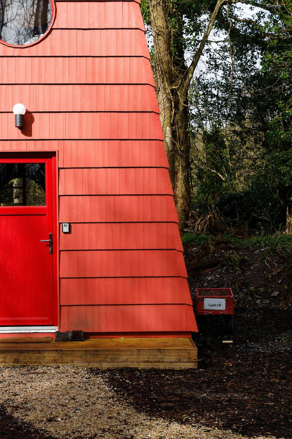 This Tiny Red Cabin Has a Lockbox for Your Phone