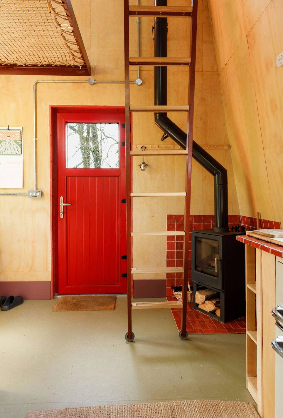 This Tiny Red Cabin Has a Lockbox for Your Phone