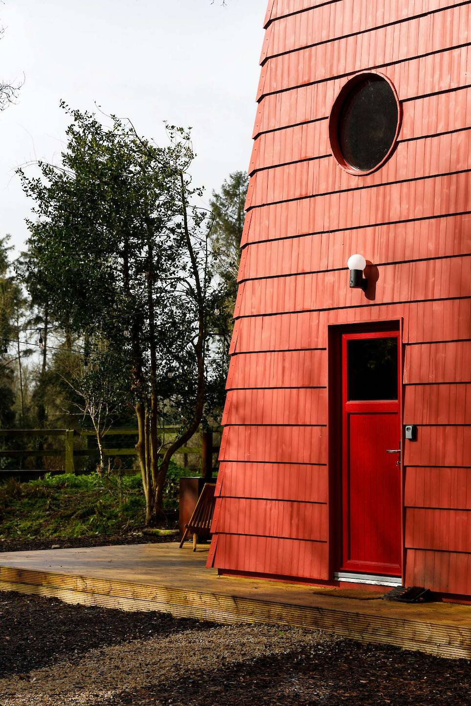 This Tiny Red Cabin Has a Lockbox for Your Phone