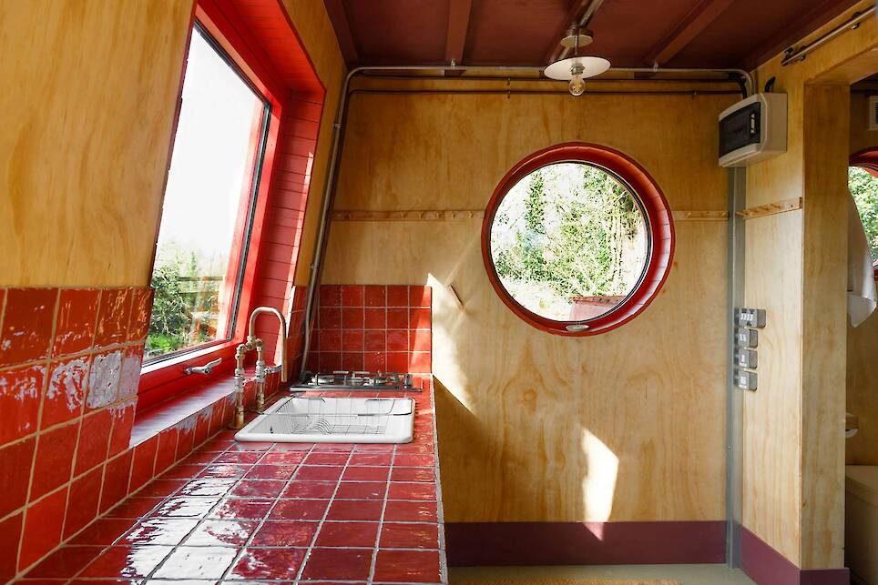 This Tiny Red Cabin Has a Lockbox for Your Phone