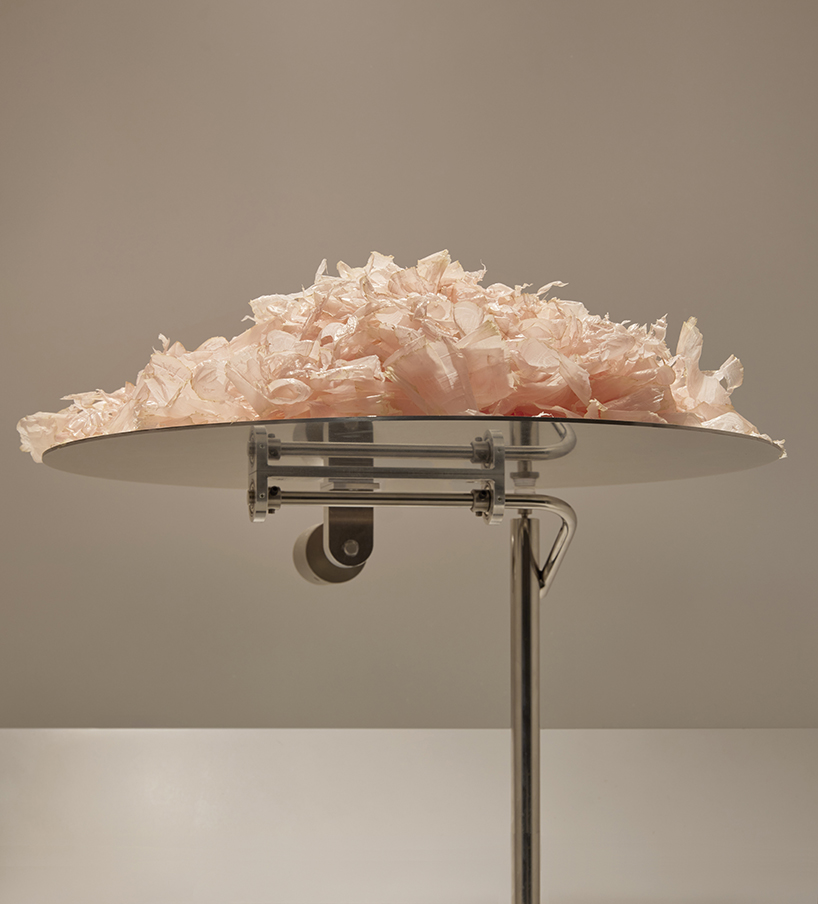A kinetic installation shaped by shaved bonito flakes forms a continuous display system