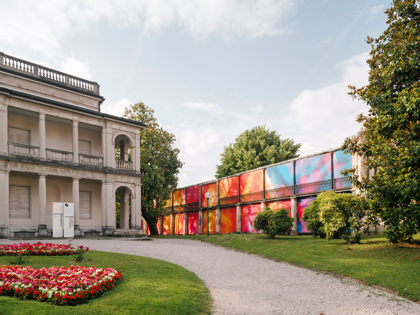 Colorful printed textile installation reimagines historic laundry building facade in switzerland