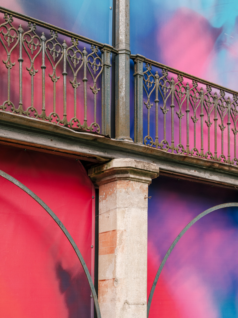 Colorful printed textile installation reimagines historic laundry building facade in switzerland