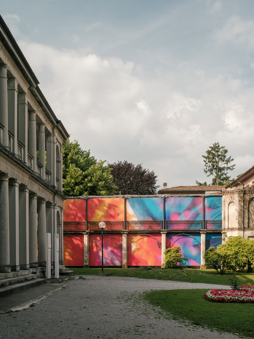 Colorful printed textile installation reimagines historic laundry building facade in switzerland