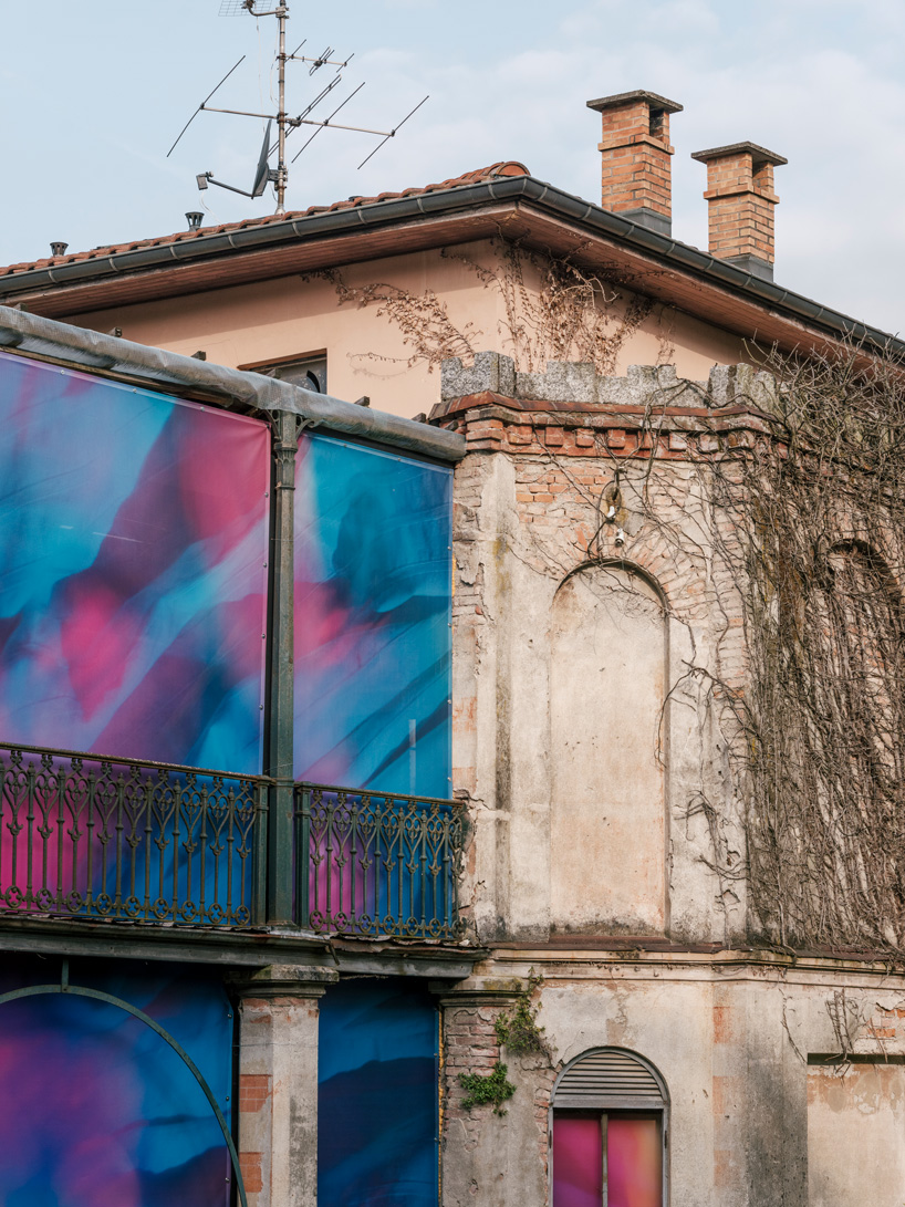 Colorful printed textile installation reimagines historic laundry building facade in switzerland