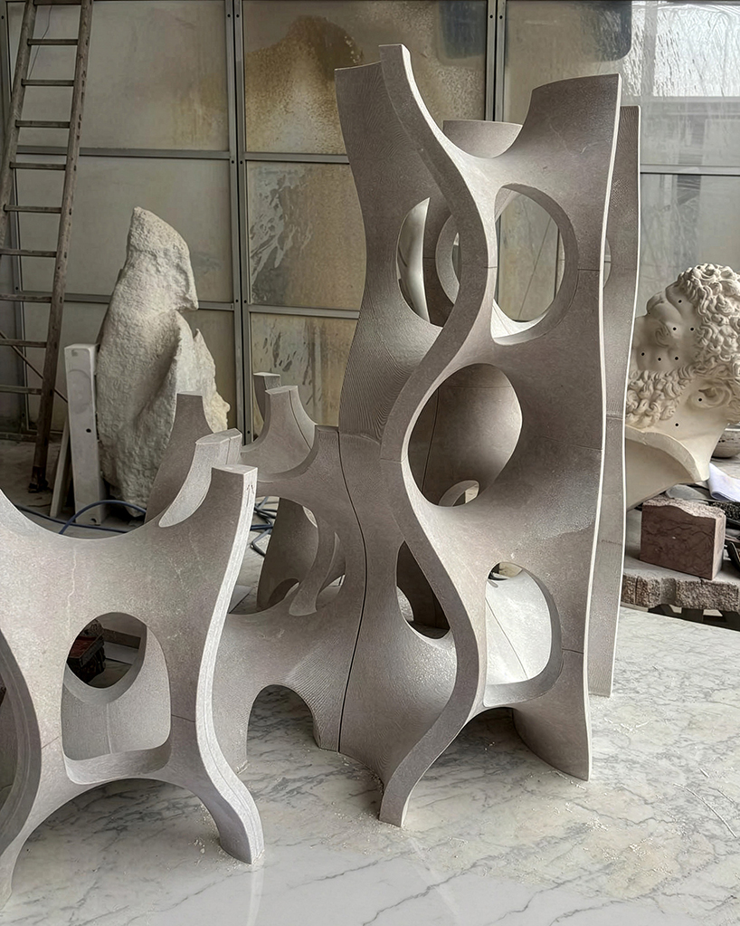 Robotic carving transforms reclaimed stone waste into porous modular system
