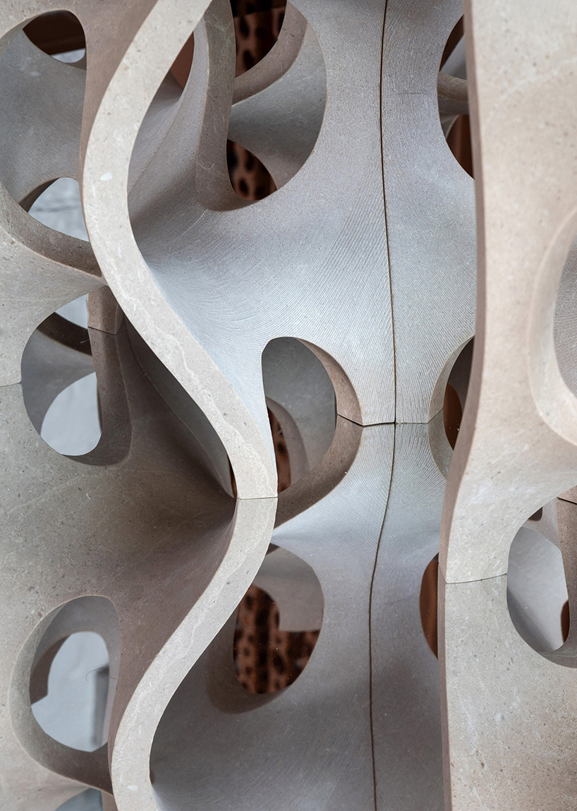 Robotic carving transforms reclaimed stone waste into porous modular system