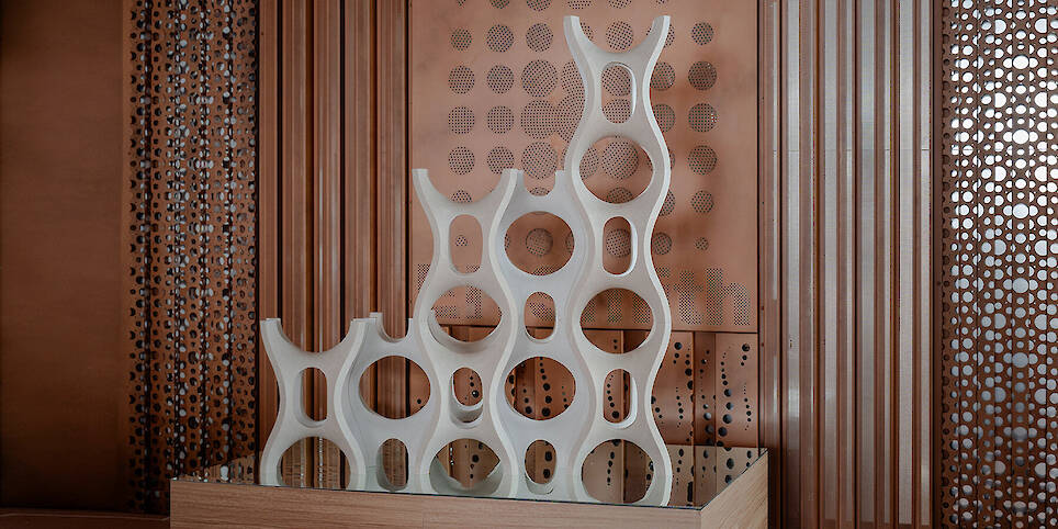 Robotic carving transforms reclaimed stone waste into porous modular system