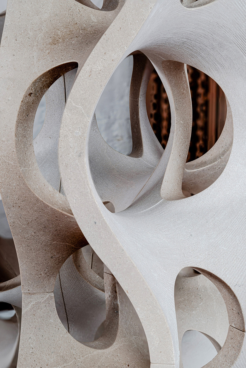 Robotic carving transforms reclaimed stone waste into porous modular system