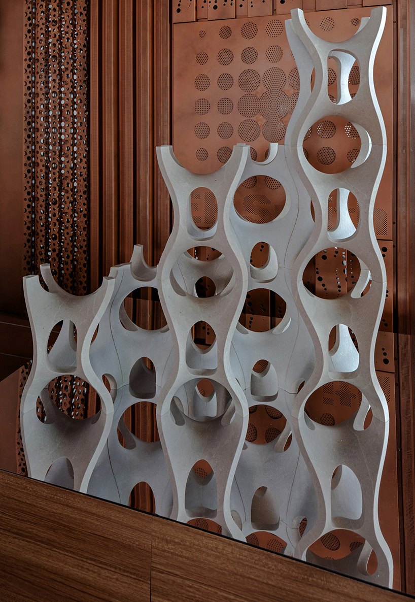 Robotic carving transforms reclaimed stone waste into porous modular system