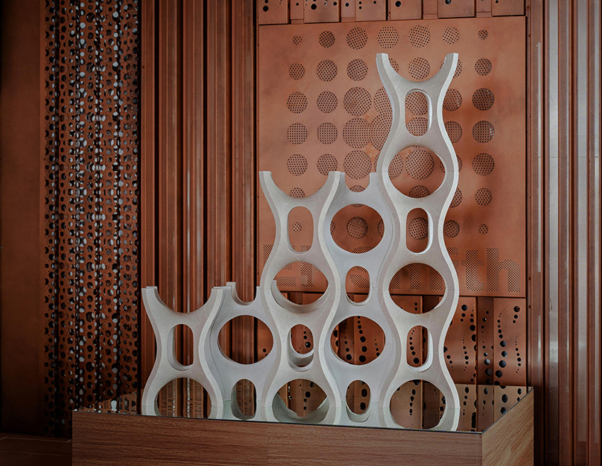 Robotic carving transforms reclaimed stone waste into porous modular system
