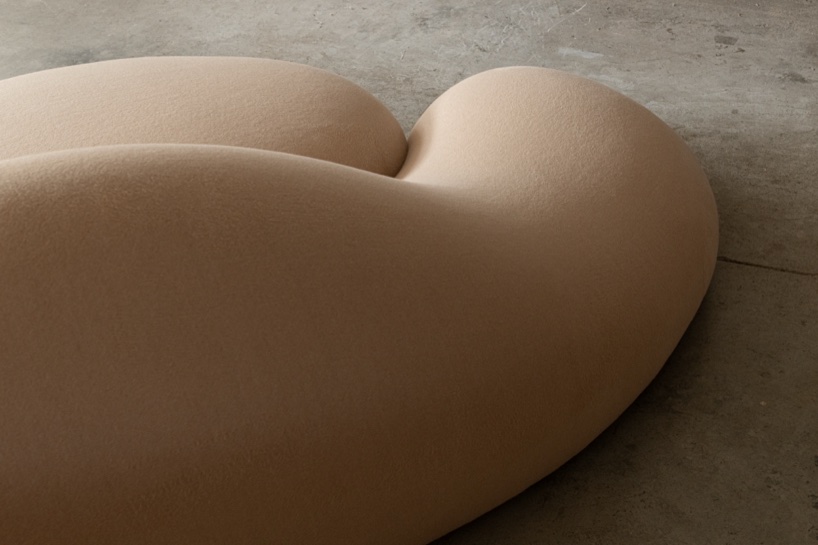 Soft monolithic forms shape a modular furniture collection in nubuck, alpaca, and oak