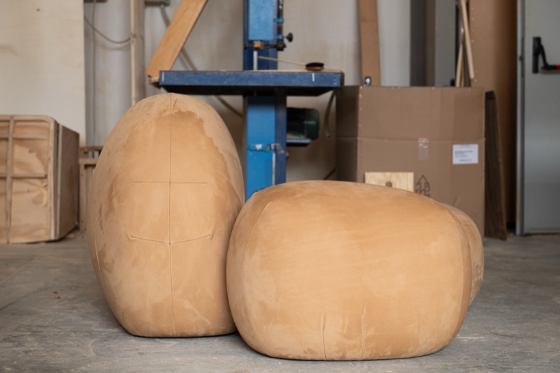 Soft monolithic forms shape a modular furniture collection in nubuck, alpaca, and oak