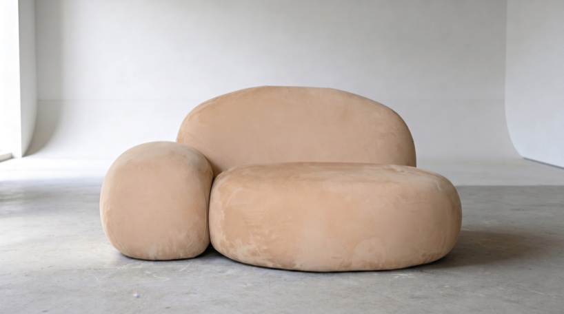 Soft monolithic forms shape a modular furniture collection in nubuck, alpaca, and oak