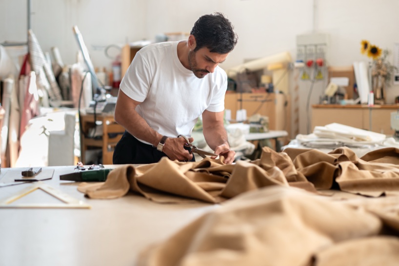 Soft monolithic forms shape a modular furniture collection in nubuck, alpaca, and oak