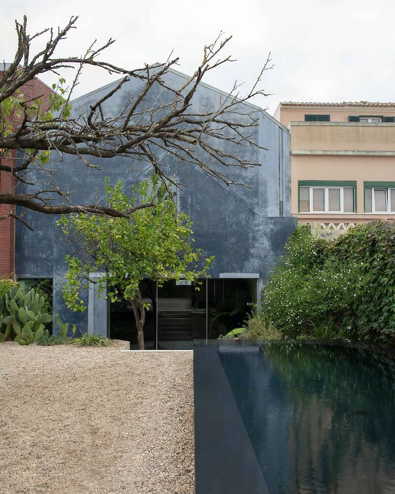 Burnished Aluminum Sheeting Covers the Entire Ground Floor of This Renovated 1893 Lisbon Home