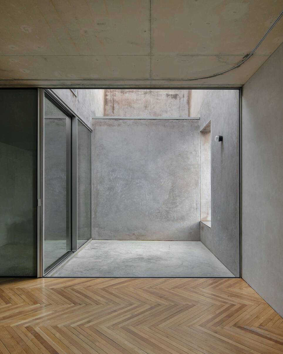 Burnished Aluminum Sheeting Covers the Entire Ground Floor of This Renovated 1893 Lisbon Home