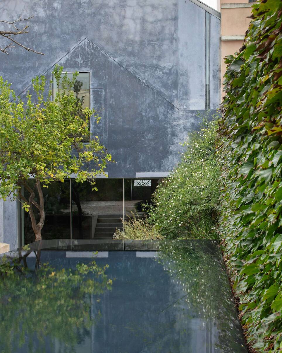 Burnished Aluminum Sheeting Covers the Entire Ground Floor of This Renovated 1893 Lisbon Home