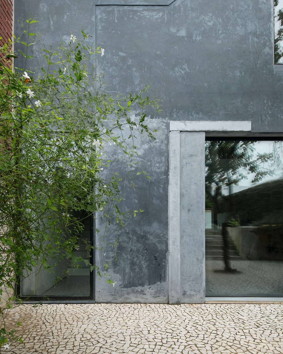 Burnished Aluminum Sheeting Covers the Entire Ground Floor of This Renovated 1893 Lisbon Home