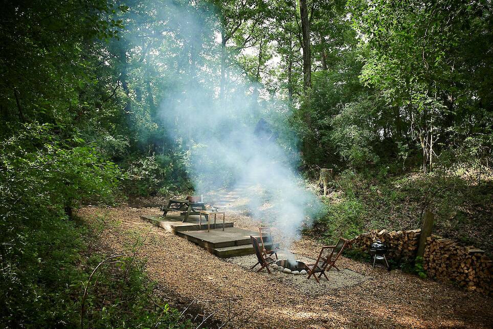 The cabins overlook a glacial basin with a social area and firepit