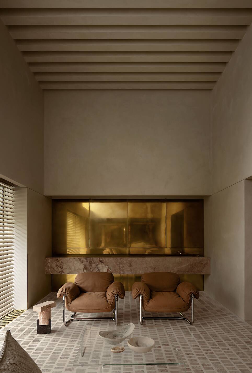 Lounge area with section of metallic cupboard / home bar doors behind
