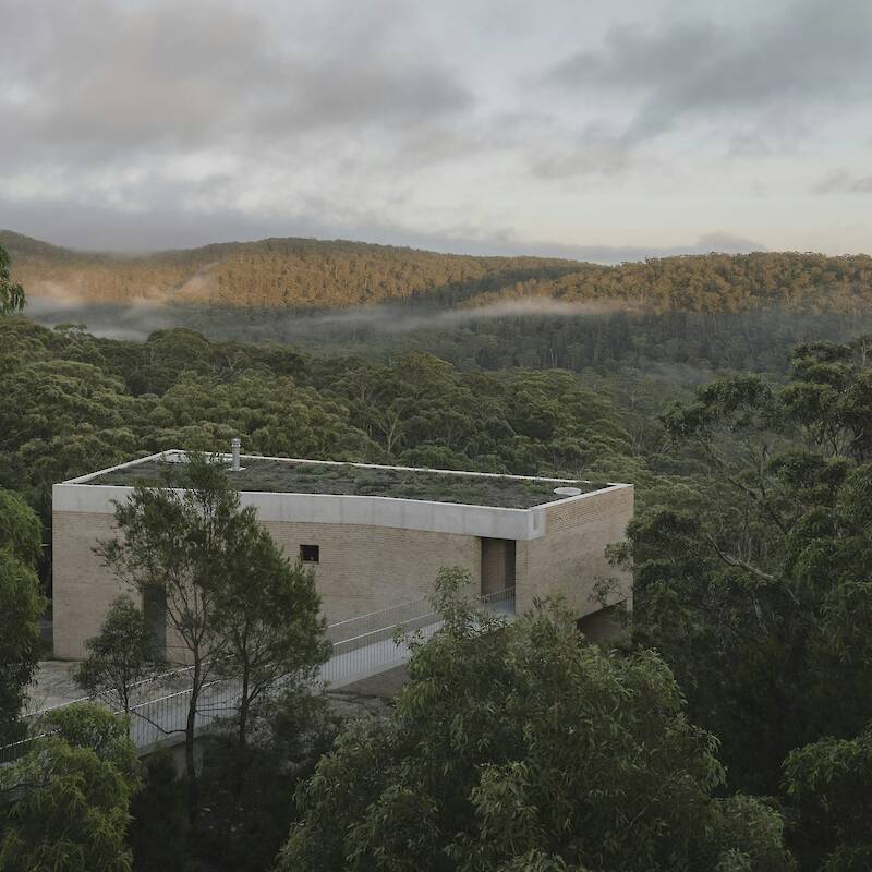 At an Australian Home Built Into a Cliff, You Enter Via the Footbridge