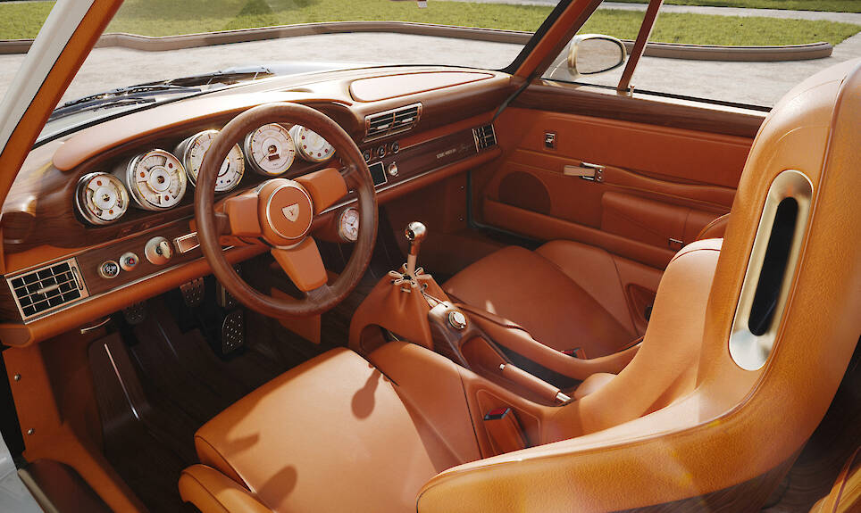 Vintage-style car interior with tan leather seats, wood trim, a manual gear shift, and analog gauges on the dashboard—reminiscent of a Singer Louis Vuitton Porsche 911. Sunlig