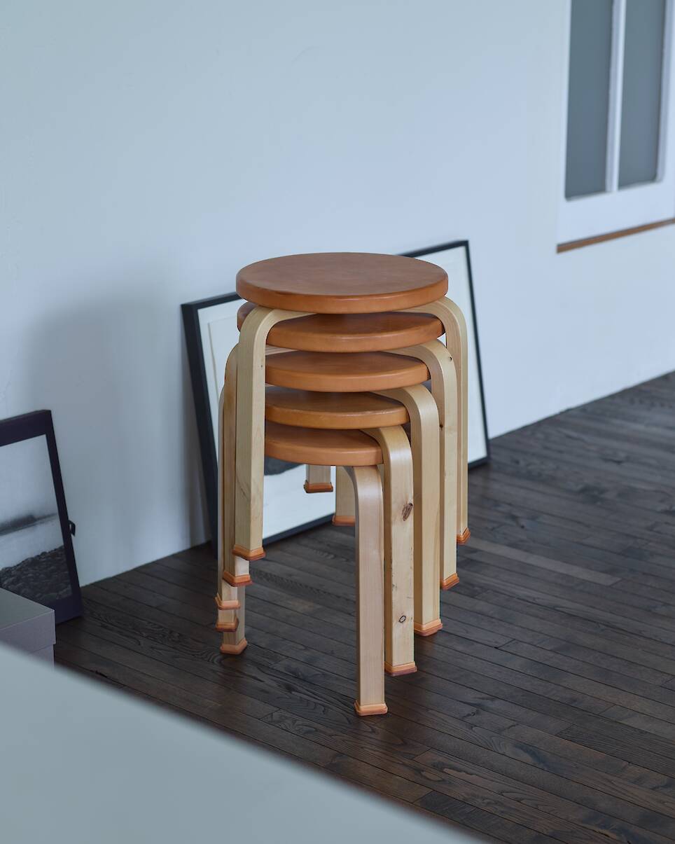 <p>A stack of the reimagined ‘Stool 60’, with leather-wrapped tops and feet</p>