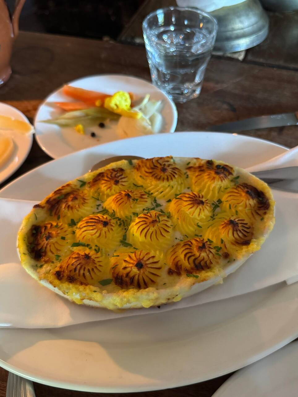 A fish pie topped with browned mashed potatoes