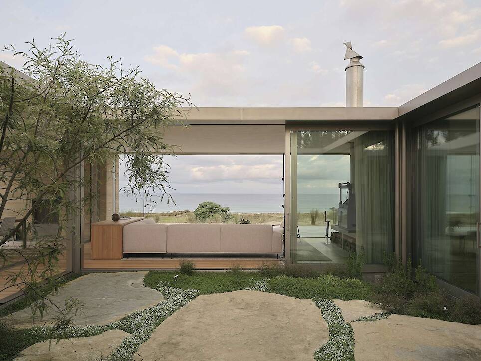 Floor-to-Ceiling Glass Sliders Peel Back Entire Walls at This Rammed Earth Home in New Zealand - Photo 13 of 18 -