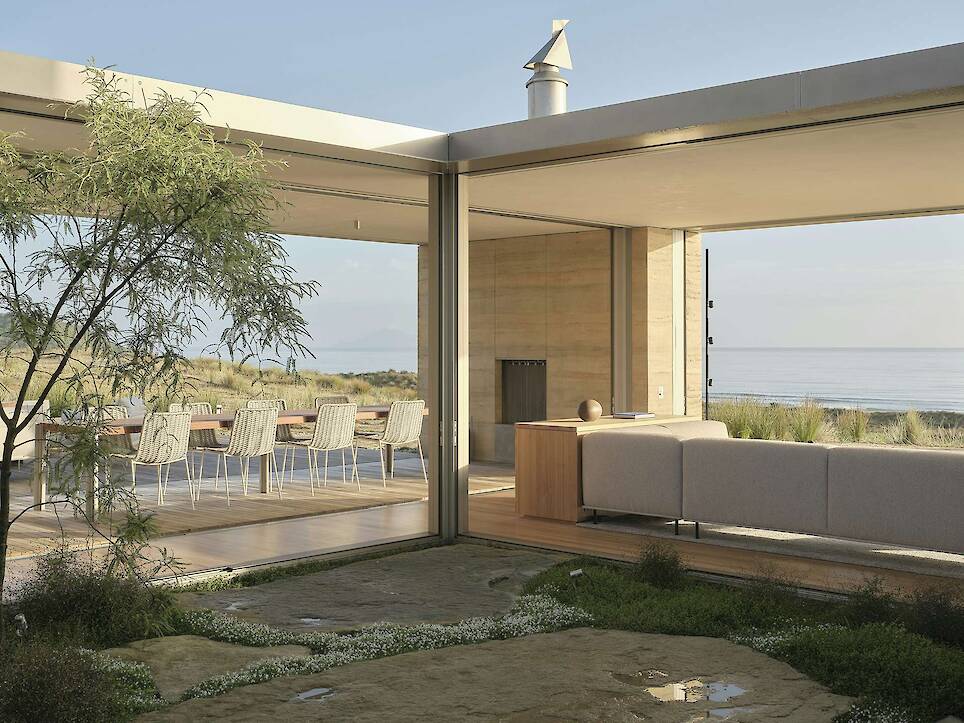 Floor-to-Ceiling Glass Sliders Peel Back Entire Walls at This Rammed Earth Home in New Zealand - Photo 7 of 18 -