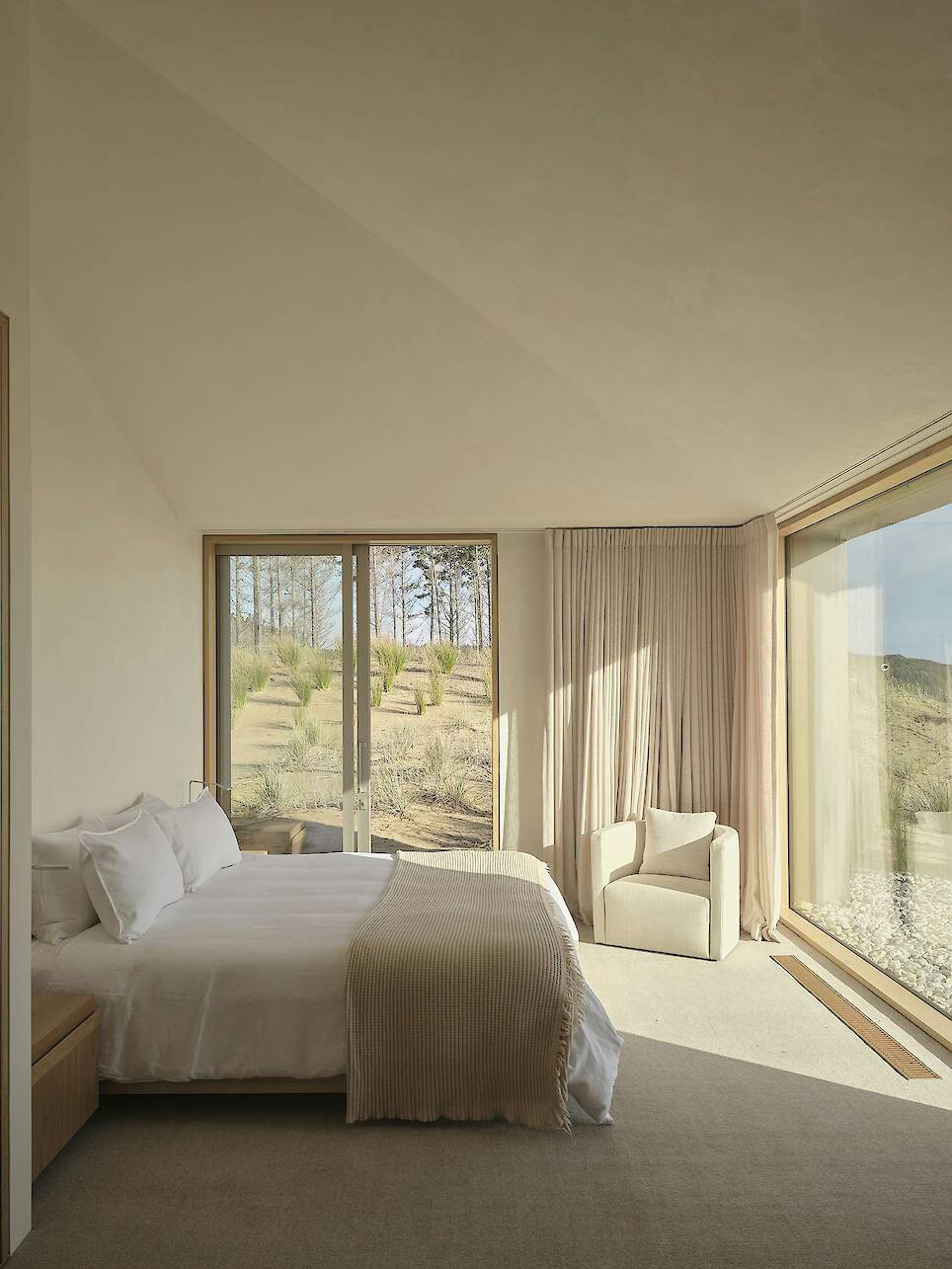Floor-to-Ceiling Glass Sliders Peel Back Entire Walls at This Rammed Earth Home in New Zealand - Photo 9 of 18 -