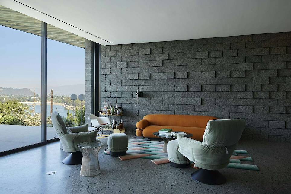 Yanai wrapped one wall of the living area in the same concrete masonry blocks by Angelus Block Co. that he specified for the exterior. "There’s lots of midcentury stuff here