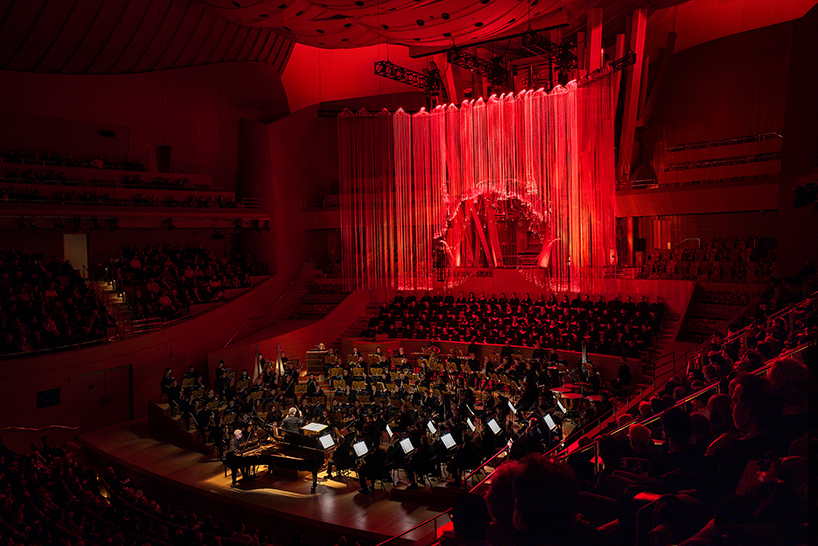 RADIANCE in a red state above the orchestra and chorus during the performance at Walt Disney Concert Hall