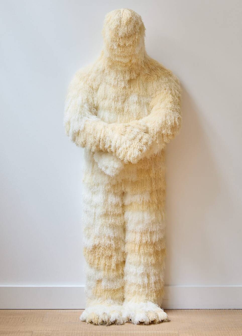 "I Hear Things Existing With Me" (2026), viscose thread embroidery, textiles, wadding, stainless steel rod, and wood, 155 x 53 x 40 centimeters