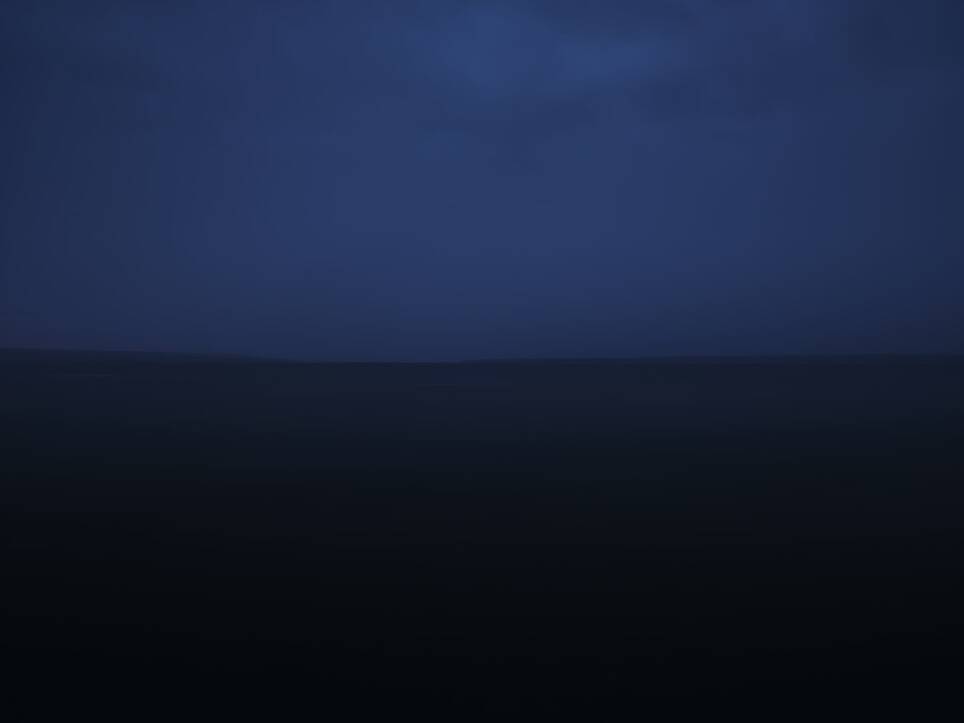 a dark, moody image of an open body of water