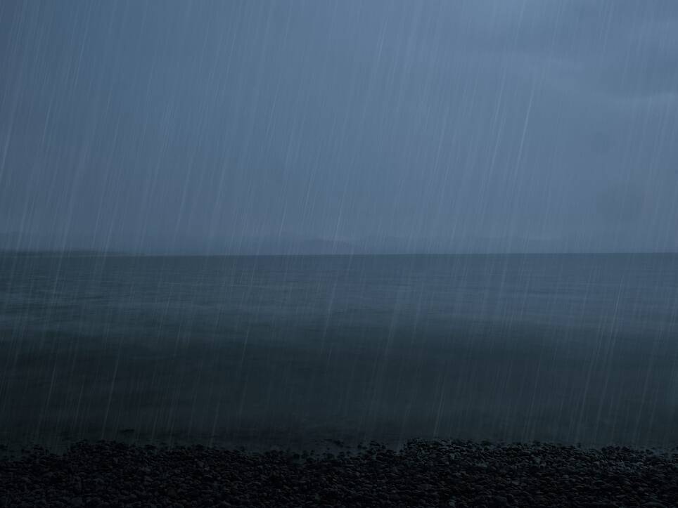 an open body of water on a rainy day