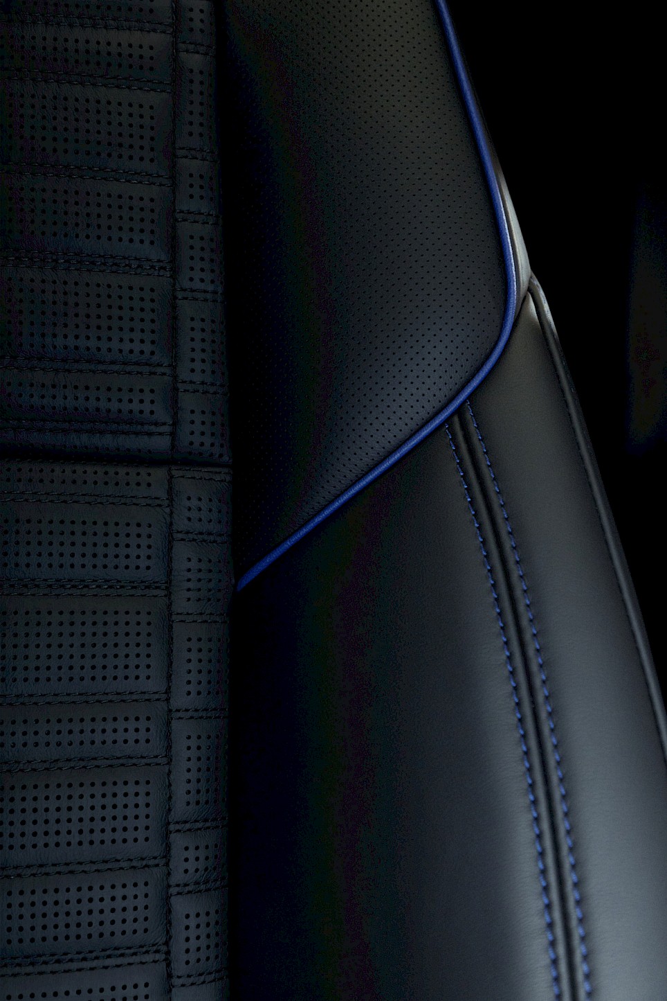 Perforated black car seat from the Cadillac Escalade-V 125th Anniversary edition, featuring blue trim and stitching