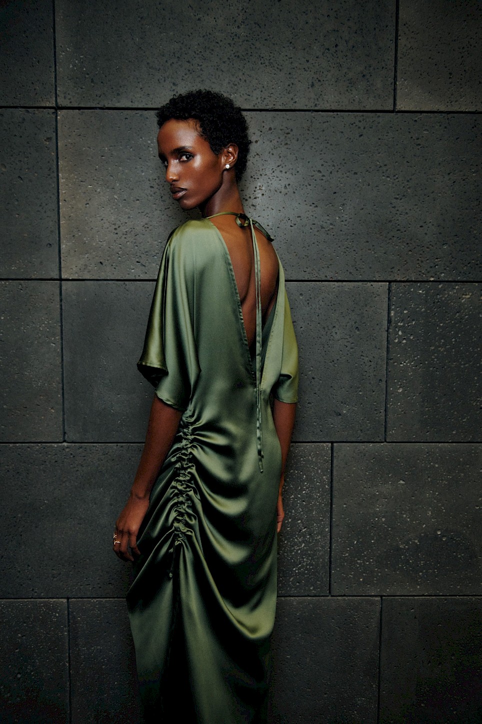 <p>Pieces span day and eveningwear, the latter including this draped silk dress in ‘kombu’ green</p>